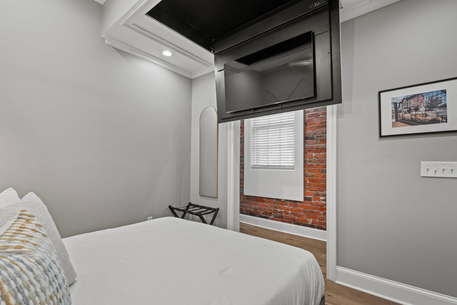 Aurelia Suite bedroom with drop-down TV