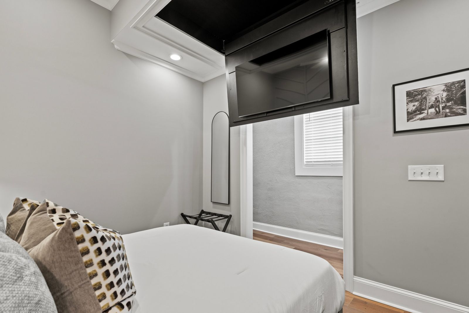 Noir Suite bedroom with drop-down TV
